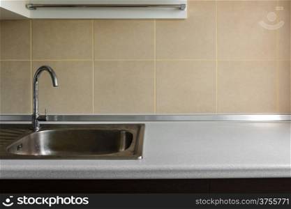 steel stylish sink in a modern kitchen and blank copy space