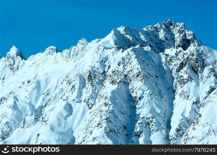 Steep rocky slope. Morning winter view. Austria.
