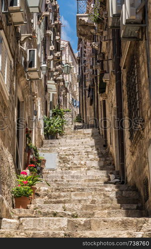 Steep steps in narrow street in the old town of Dubrovnik in Croatia. Steep steps and narrow street in Dubrovnik old town