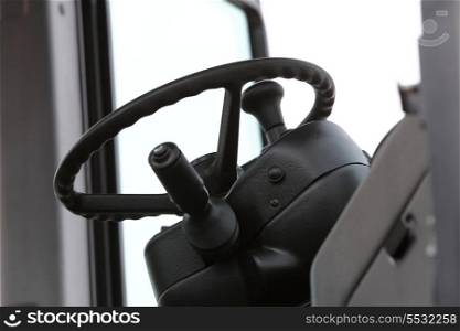 Steering wheel in interior of a new industrial machine