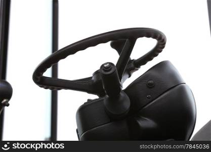 Steering wheel in interior of a new industrial machine