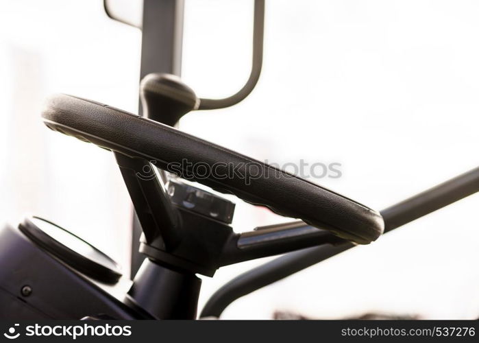 Steering wheel in interior of a new industrial machine. Truck details concept.. Steering wheel in tractor truck