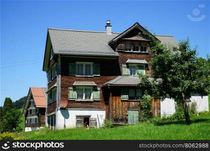 STEIN, SWITZERLAND - CIRCA JULY 2016 Wooden house on the green grass