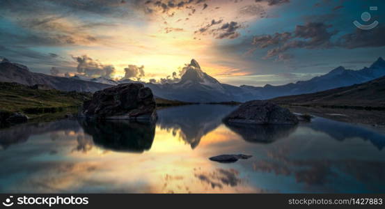 Stellisee lake in Zermatt, Switzerland at sunset with reflection of mount Cervino or Matterhorn