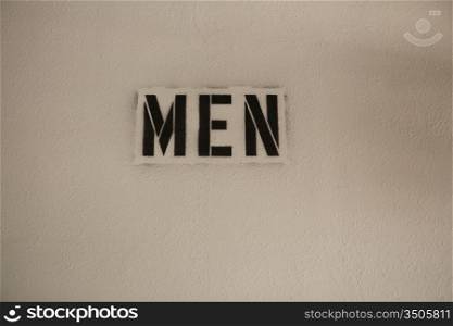 Stenciled Sign on Wall, Men
