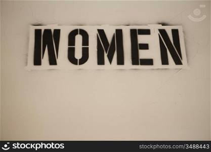 Stenciled Sign on Wall, Women