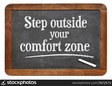 step outside your comfort zone - motivational advice on a vintage slate blackboard