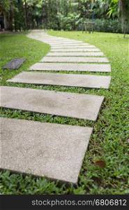 step walkway in grass lawn yard in garden