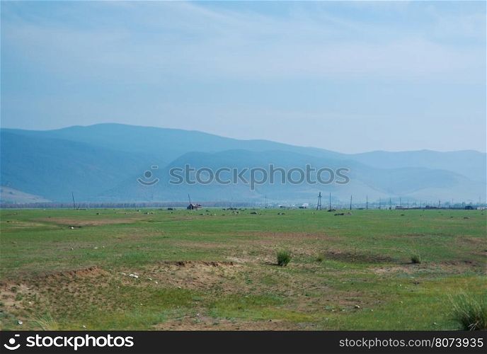 Steppe on a background of mountains .Barguzin valley,Buryatia, Russia.
