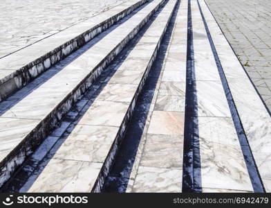 Steps made from pieces of marble in cement. Stone building. Steps made from pieces of marble in cement. Stone building.