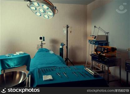Sterile operation room in the hospital display sets of medical surgical equipments arranged on the table. Surgery room with surgical tools background for medical purpose.. Sterile operation room in hospital display sets of medical surgical equipments.