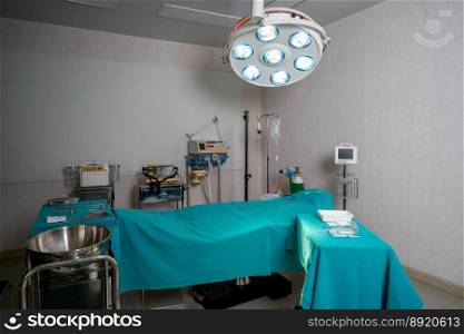 Sterile operation room in the hospital display sets of medical surgical equipments arranged on the table. Surgery room with surgical tools background for medical purpose.