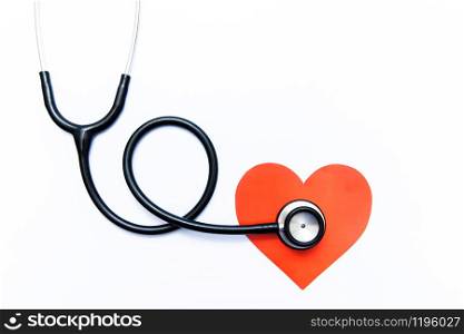 Stethoscope and heart on white background