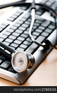 Stethoscope and keyboard illustrating concept of digital security