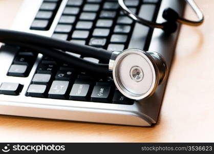 Stethoscope and keyboard illustrating concept of digital security