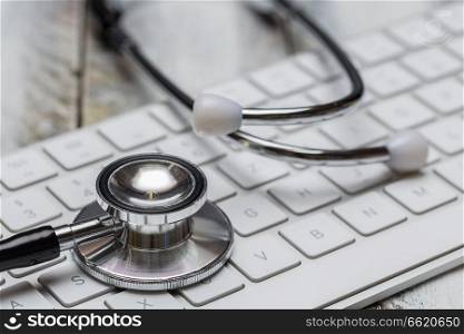 Stethoscope and keyboard macro concept.. Stethoscope and keyboard macro concept