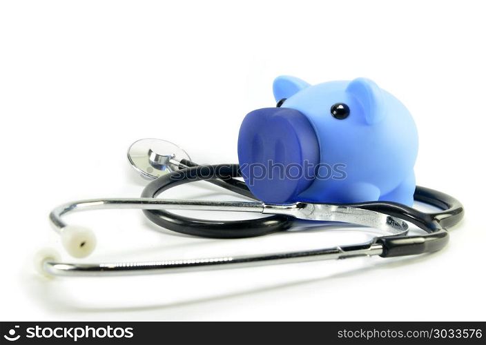 Stethoscope and piggy bank showing medical or financial concept. Stethoscope and piggy bank