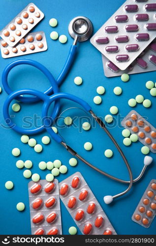 stethoscope and pills