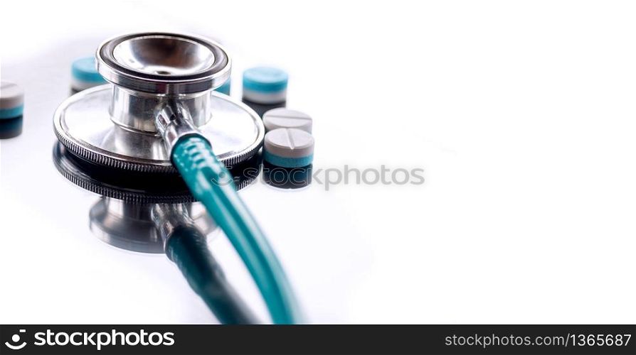 Stethoscope and pills on a white background, The concept of medicine and medical treatment.
