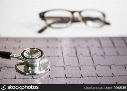 stethoscope cardiogram with eyeglasses