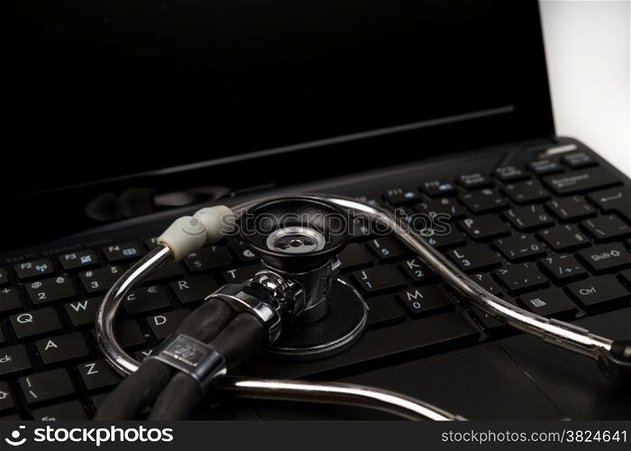 Stethoscope on computer netbook