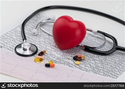 Stethoscope on electrocardiogram, and toy heart. Concept healthcare. Cardiology - care of the heart. cardiology, heart care