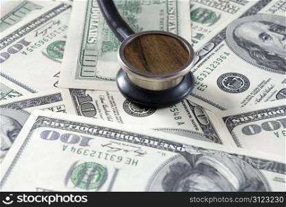 Stethoscope on money background of dollars
