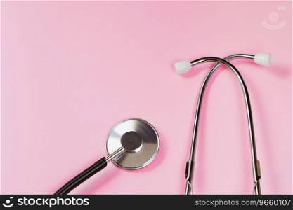 Stethoscope on pink background. Health care concept. Medical instrument for diagnosing diseases. Copy space.. Stethoscope on pink background. Health care concept. Medical instrument for diagnosing diseases.