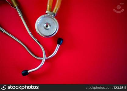 stethoscope on red coronavirus background