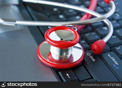 Stethoscope on the computer keyboard