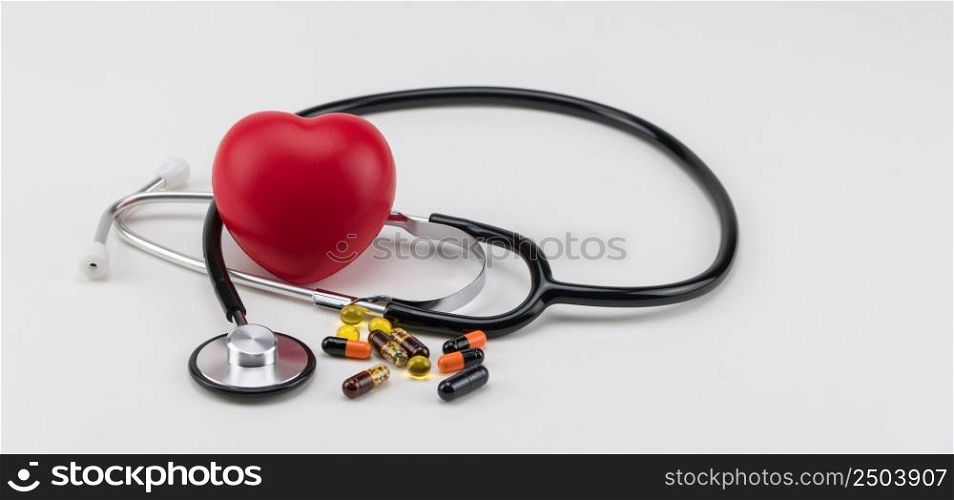 Stethoscope, pills and toy heart. Concept healthcare. Cardiology - care of the heart. cardiology, heart care