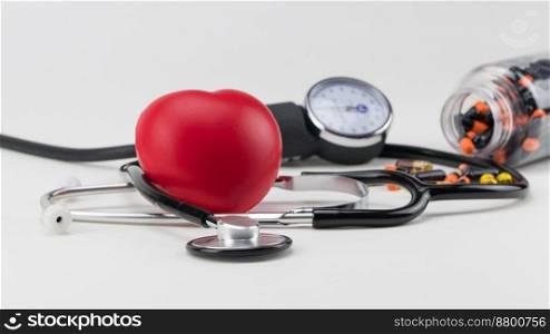 Stethoscope, pills and toy heart. Concept healthcare. Cardiology - care of the heart. cardiology, heart care