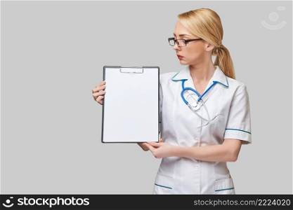 Stethoscope, syringe and&oules with medicines or vaccine over blue background.. Stethoscope, syringe and&oules with medicines or vaccine over blue background