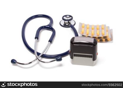 stethoscope, tablets and doctor seal isolated on white background