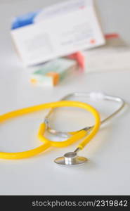 Stethoscope with medication on the table. Concept for health and medicine. Hospital background.