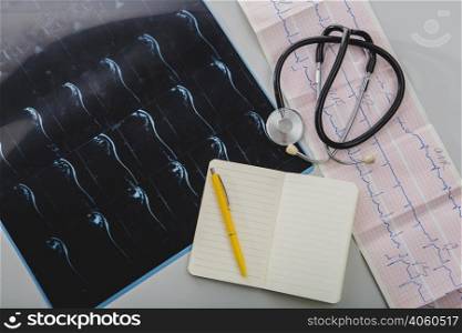 stethoscope with notepad x ray shot