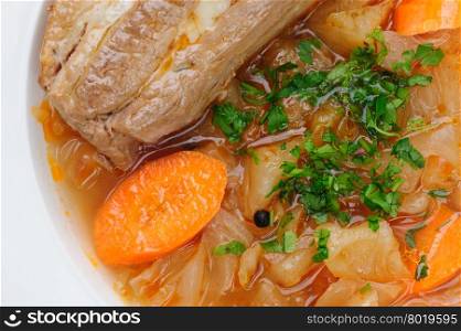 Stewed cabbage and other vegetables with pork meat. Stewed cabbage with pork meat