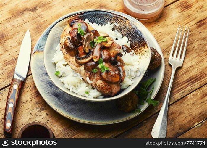 Stewed chicken breast with marsala mushroom gravy and rice.. Chicken with mushroom sauce.