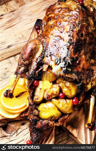 Stewed duck food. Appetizing roasted duck with oranges cooked to a rustic recipe
