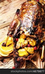 Stewed duck food. Appetizing roasted duck with oranges cooked to a rustic recipe