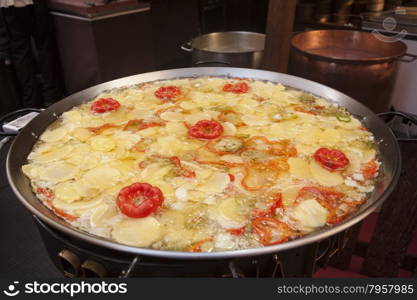 Stewed fresh vegetables including potatoes peppers onions eggs.On the outdoor grill. Stewed fresh vegetables including potatoes peppers onions eggs. On the outdoor grill.