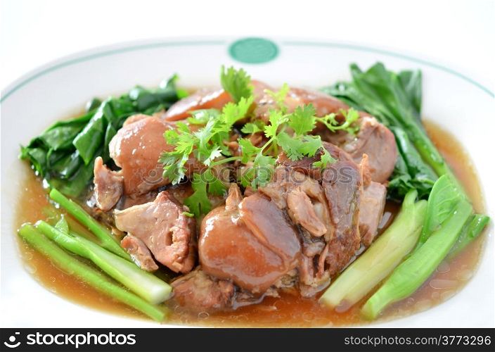 stewed pork knuckle with kale inside , chinese cuisine