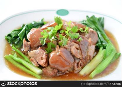 stewed pork knuckle with kale inside , chinese cuisine