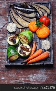Stewed summer vegetables. Roasted summer vegetables on the kitchen cutting board