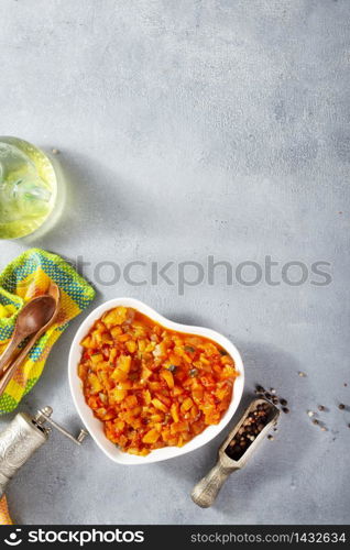 Stewed zucchini potatoes carrot and pepper with tomato sauce