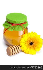 stick to hohey ,flower and jar of honey isolated on white
