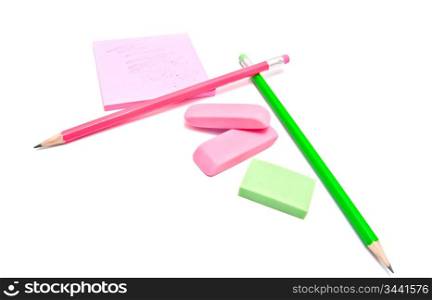 sticky note, erasers and pencils on white