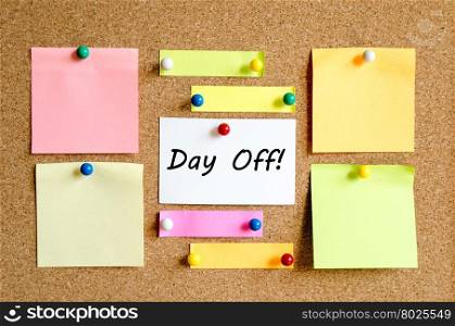 Sticky Note On Cork Board Background And Day Off Text Concept