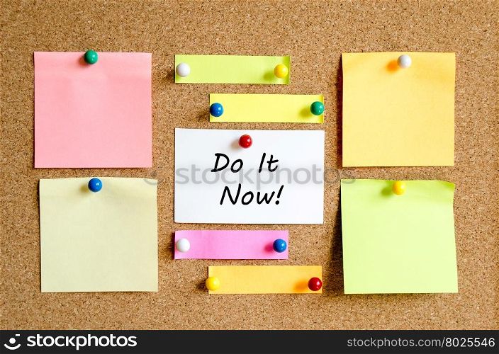 Sticky Note On Cork Board Background And Do It Now Text Concept
