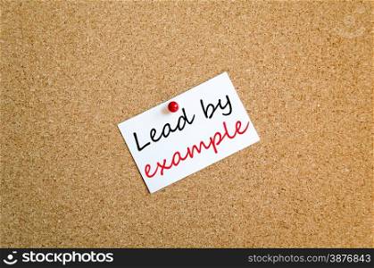 Sticky Note On Cork Board Background Lead by example concept